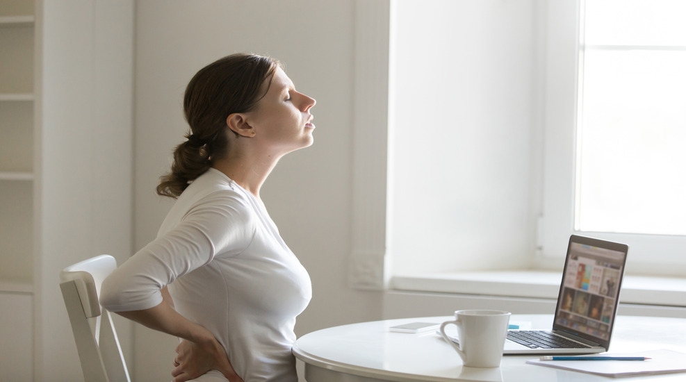 Person performing rehabilitation exercises for lower back pain relief