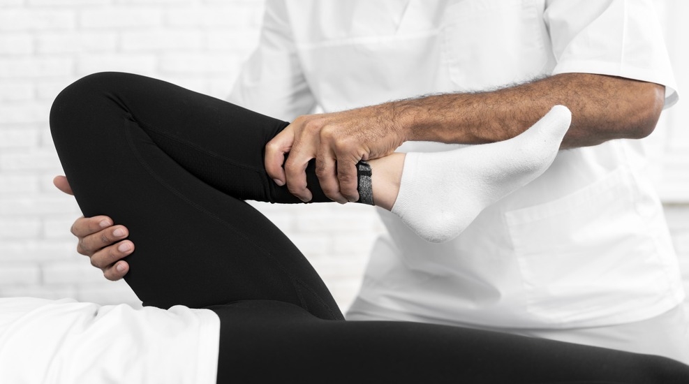 Patient undergoing physiotherapy after joint replacement surgery, focusing on rehabilitation techniques.