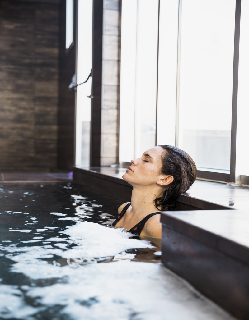 Therapist assisting a patient with hydrotherapy exercises