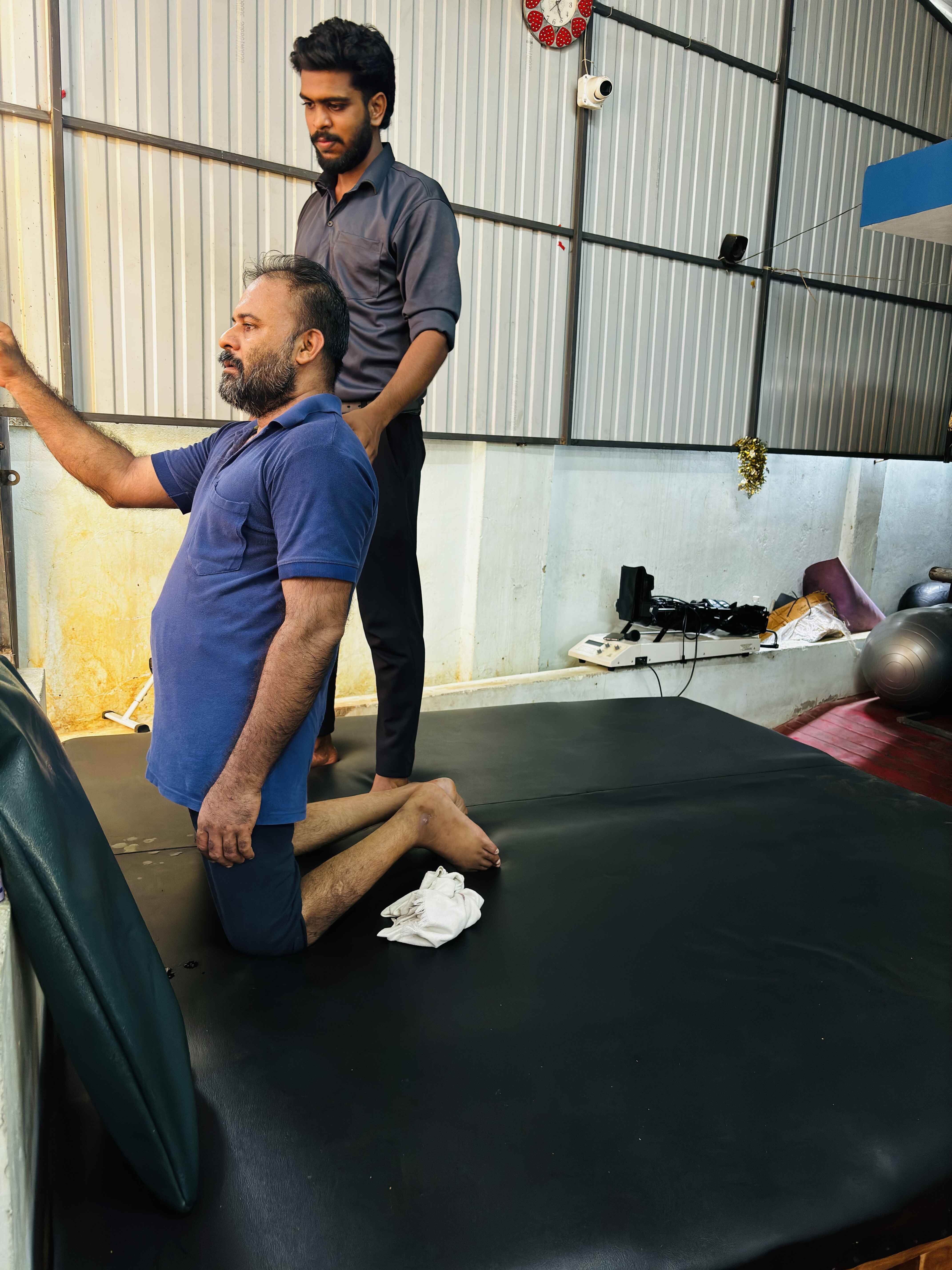 Physiotherapist assisting patient at Newlife Rehabilitation Centre